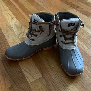 Gently used Sperry kids boots with pink sole detail.